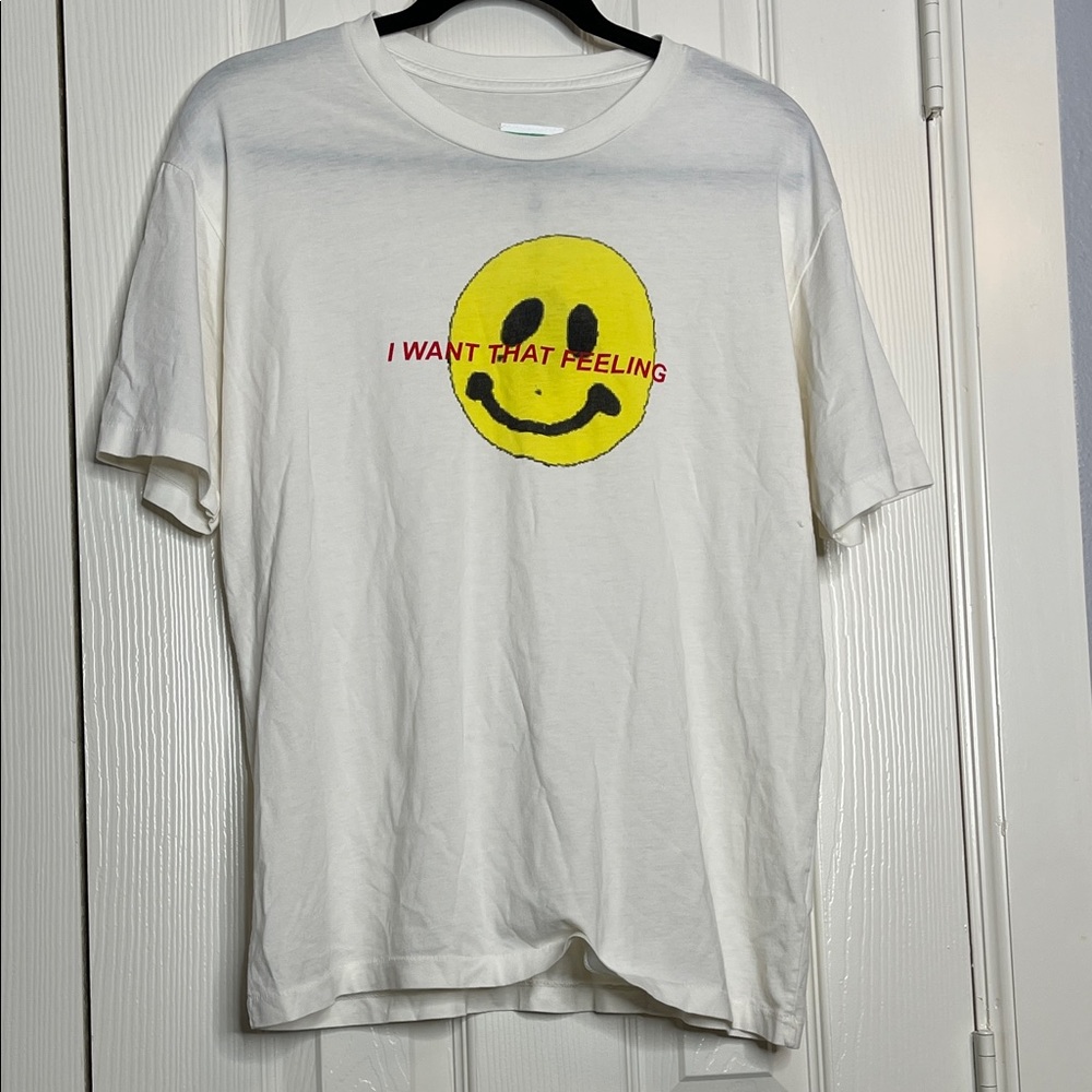 NWT UNIF White Tee with Yellow Smiley and Red Text